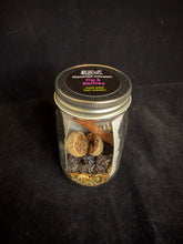 Load image into Gallery viewer, Jar with contents on a black background