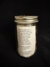 Load image into Gallery viewer, Jar with an ingredient label on a black background
